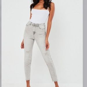 High waisted distressed jeans